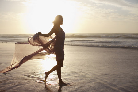 Woman walking on beach